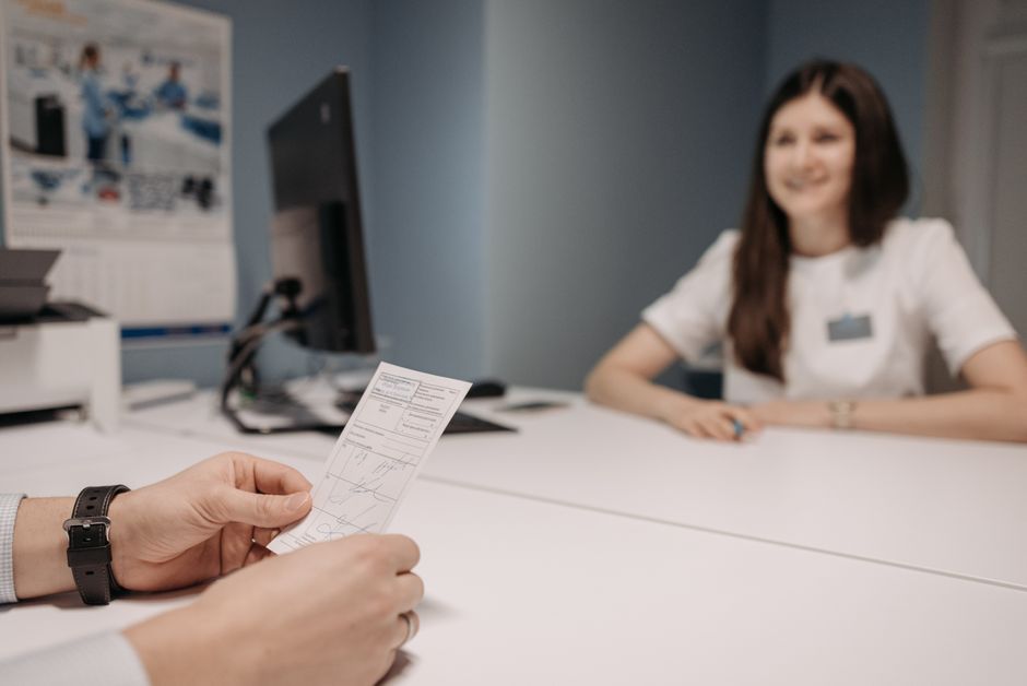 Doctor discussing a prescription with a patient during a medical consultation