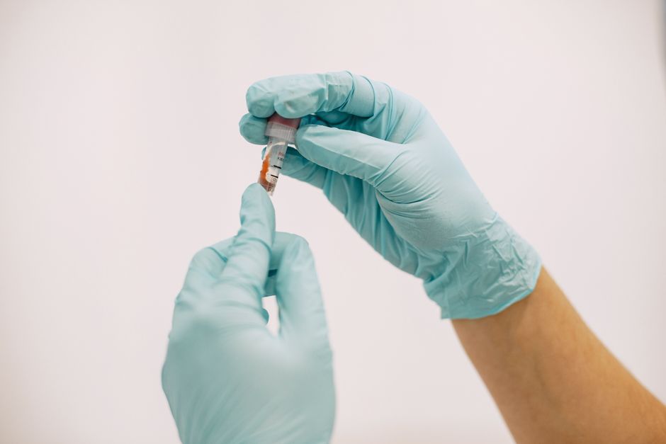 Lab technician reviewing a urine drug test sample for oxycodone screening