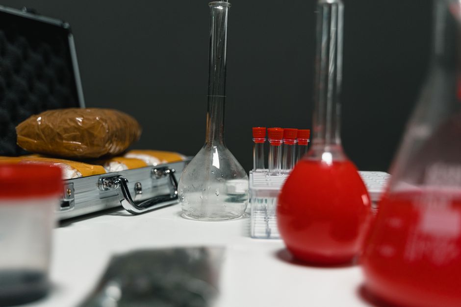 Laboratory technician analyzing a urine sample for oxycodone drug test cutoff levels