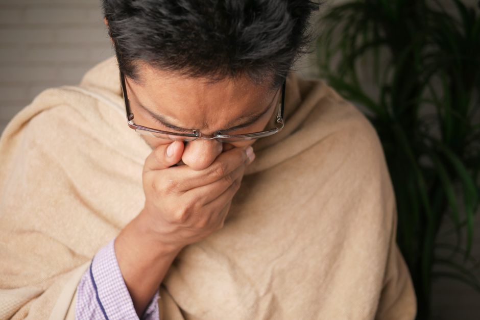 Person experiencing early signs of oxycodone withdrawal such as chills and discomfort