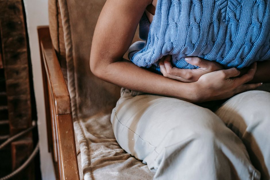 Person experiencing muscle cramps in their leg during oxycodone withdrawal