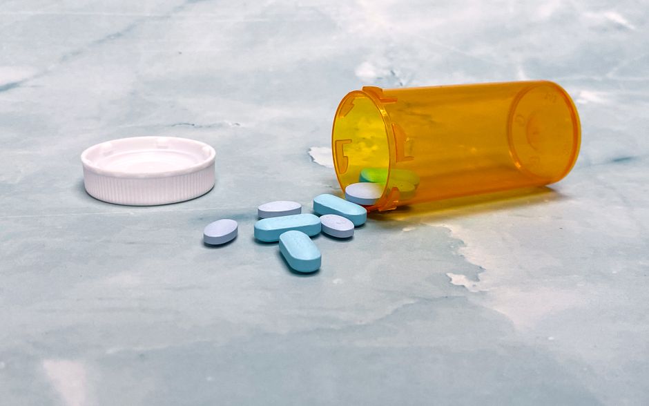 Pharmacist reviewing an oxycodone prescription bottle at an Arizona pharmacy