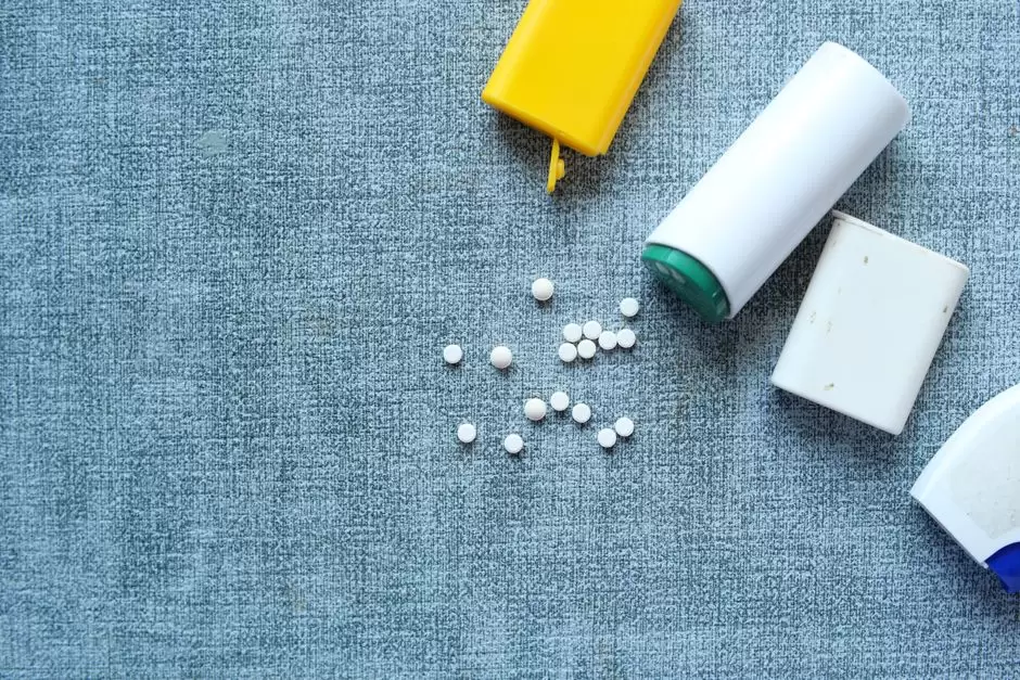 Ibuprofen tablets next to an oxycodone prescription bottle representing drug interaction safety