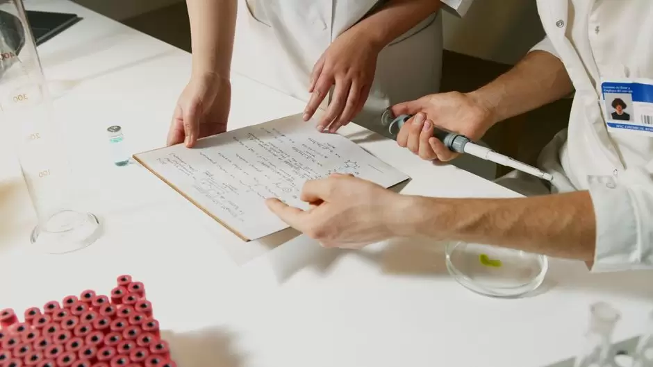 Laboratory technician examining a urine drug test sample for oxycodone detection