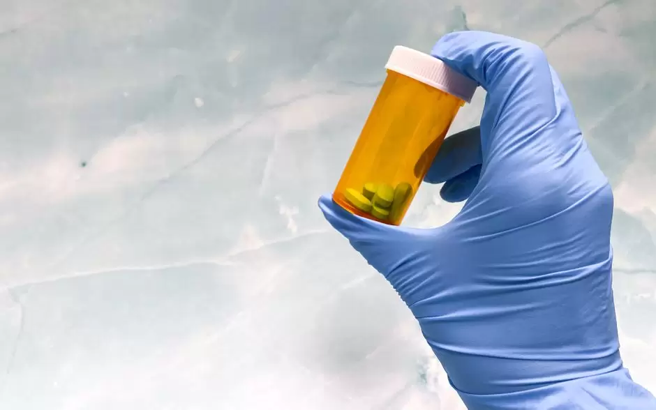Oxycodone prescription bottle with pills on a table, representing oxycodone information for Texas patients