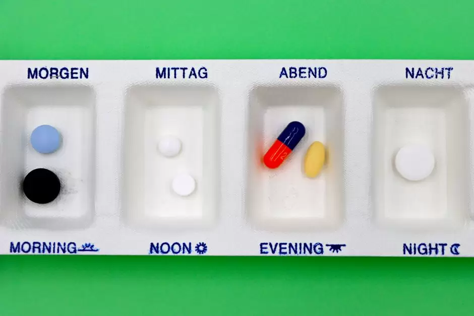 Pill organizer and clock representing a missed oxycodone dose and medication schedule